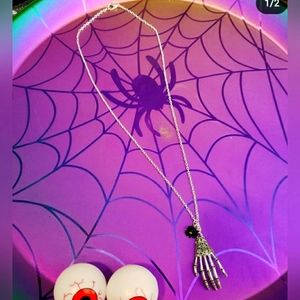 Silver Skelton necklace with a black rose! Brand new